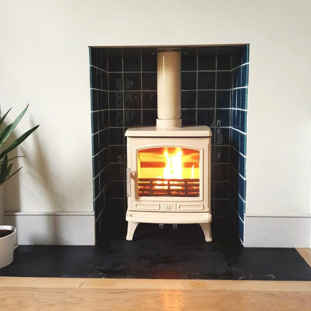 Front view of Eco Design Ready ACR Oakdale wood burning stove, in Buttermilk Enamel, installed in Penge, London SE20