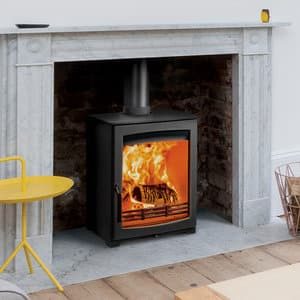 Aspect 5 compact eco wood burning stove down with a Georgian mantle